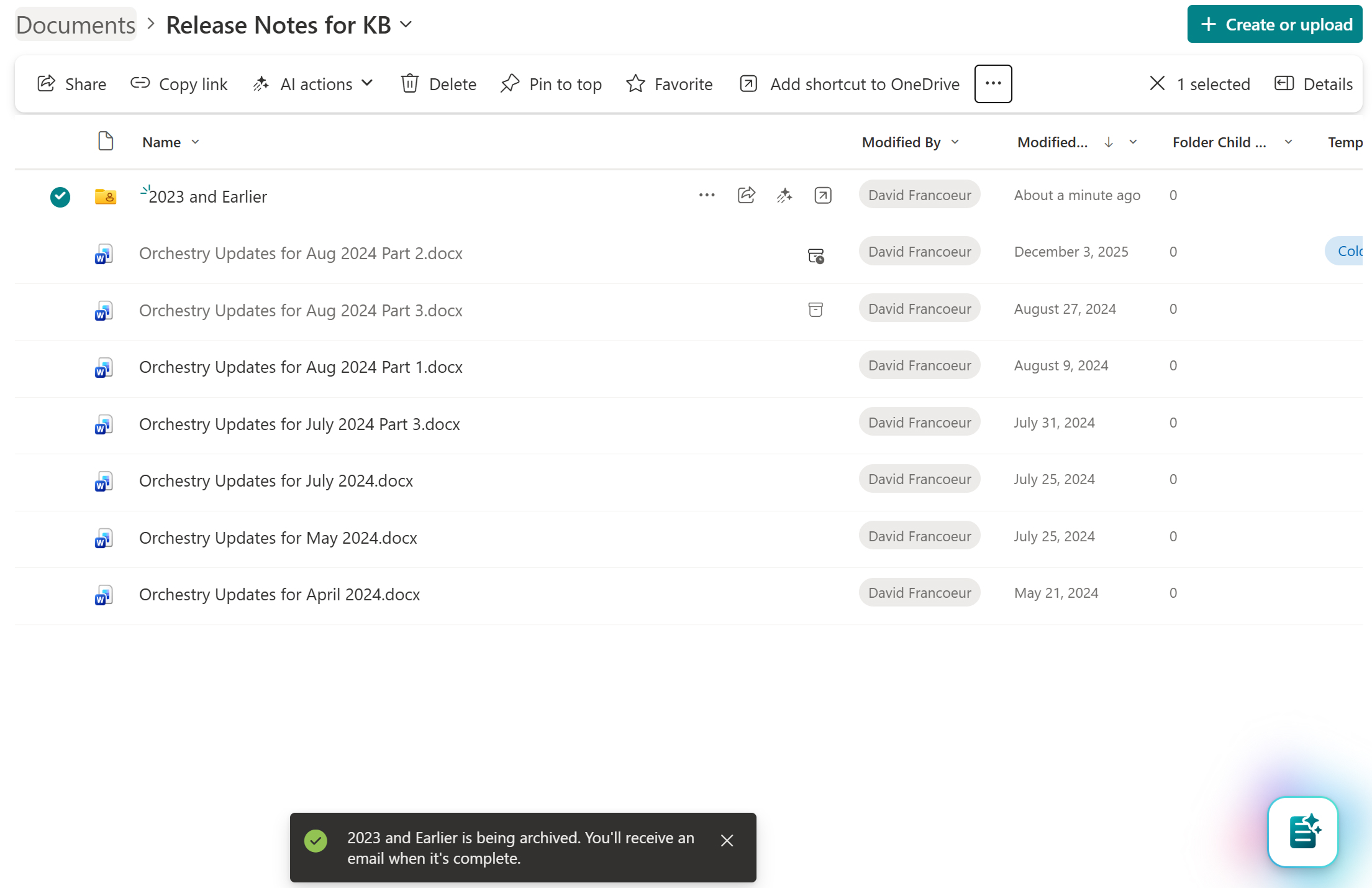 SharePoint toast notification confirming a folder is being archived and that the user will receive an email when complete